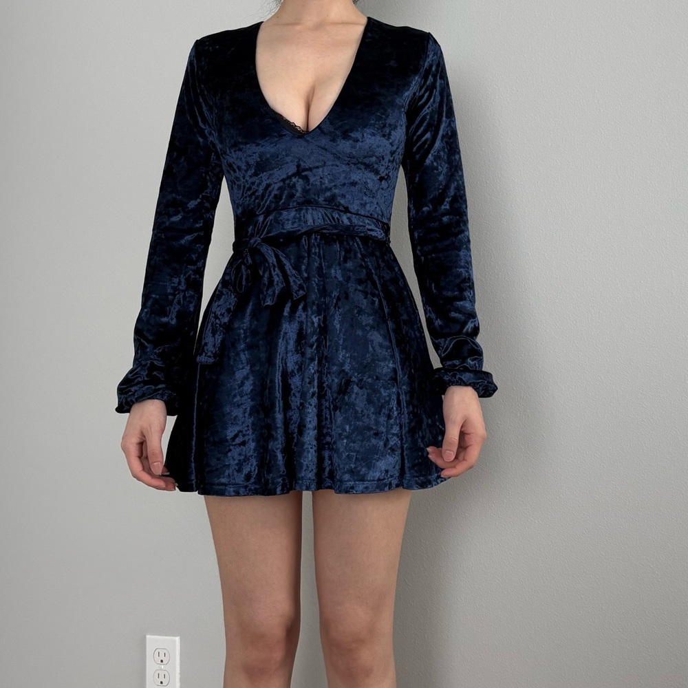 Navy blue velvet mini dress with long sleeves and tie waist